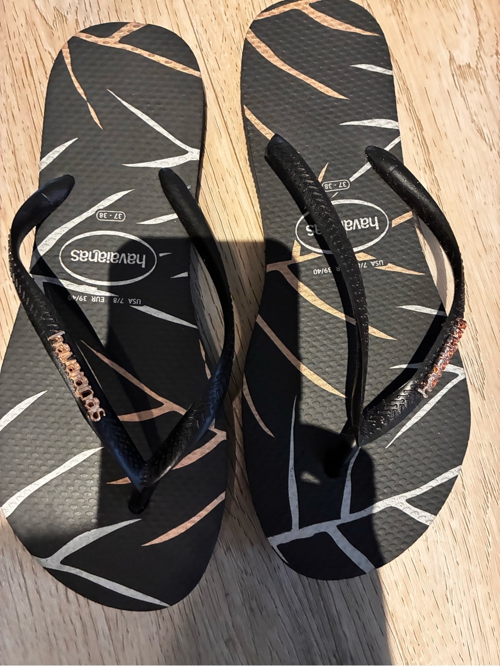 Havaianas Women’s Black Flip Flops with Rose Gold Accents